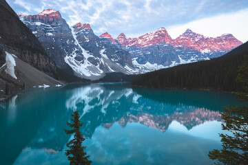 Scenic sunset or sunrise view of glacial Moraine Lake landscape, a popular tourist destination in...