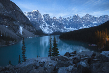 Twilight or blue hour view at night of Moraine Lake landscape, a popular tourist destination in Banff National Park, Alberta, Canada in the Rocky Mountains.