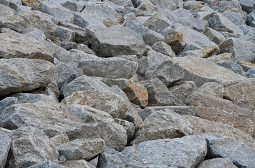 Granite stones and rocks on the shore. Geology.