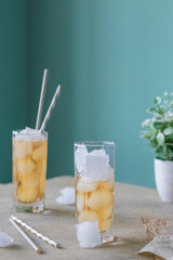 Delicious green tea with ice on the table. Refreshing summer drink. Natural product.