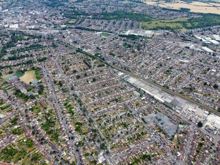 Aerial footage by drone high angle view of London Luton City of England with Buildings