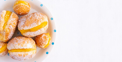 Bola de Berlim, or Berlin Ball, a Portuguese pastry made from a fried doughnut filled with sweet...