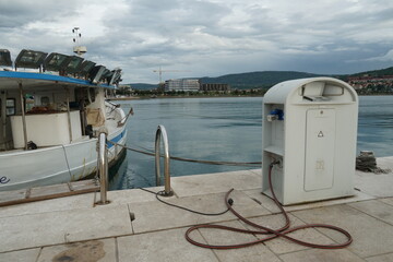 Koper, Slovenia - 05 07 2022: Fishing boat with light projectors moored in port in town of Koper...