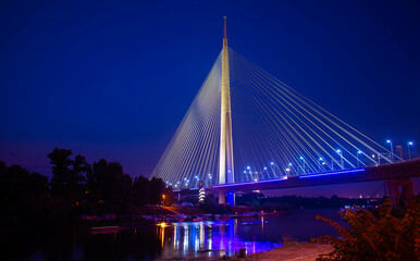 Obraz premium Ada Bridge in Belgrade Serbia nightscape with Sava river marina in front