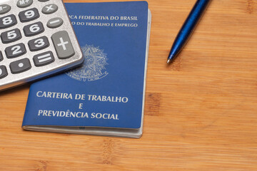 LAURO DE FREITAS, BRASIL - JULY 21, 2022 :brazilian work document with a calculator