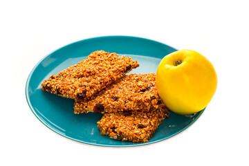 granola bars on ceramic plate isolated on white