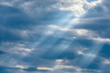 Dramatic blue sky with many rays of light - obrazy, fototapety, plakaty