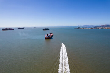 San Francisco Bay Shipping Lanes with speed boat and wake in foreground