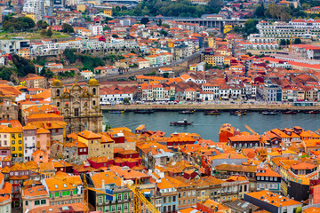 Aerial view of old historical buildings of Porto city and Vila Nova de Gaia with Douro River,...