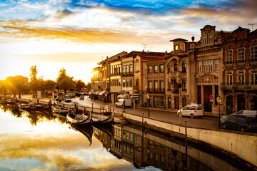 Aveiro, Portugal, Moliceiro boats docked along the central city canal during sunset