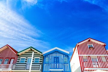 Costa Nova, Portugal: colorful striped houses called Palheiros located in beach resort on Atlantic...