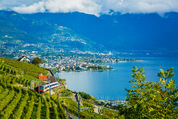 Lavaux, Switzerland: SBB train traveling on a railway through Lavaux vineyard terraces on the shore of Lake Geneva, Canton Vaud