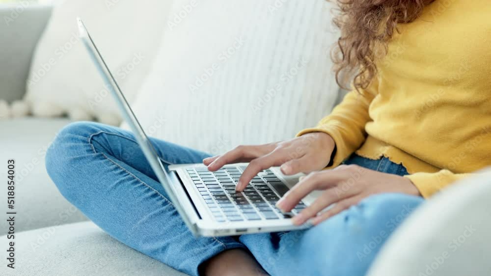Poster Dedicated learner working on a digital school project before deadline. Female student typing an online assignment on a laptop at home. Aspiring writer or language interpreter speed writing an essay.
