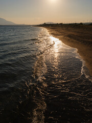 beach and sea waves at sunset