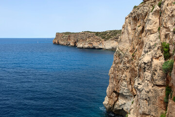 Fototapeta na wymiar View point with spectacular views located on the south coast of Menorca, in the town of Cala en Porter. View from Cova d'en Xoroi - caves at Menorca (Minorca), Spain
