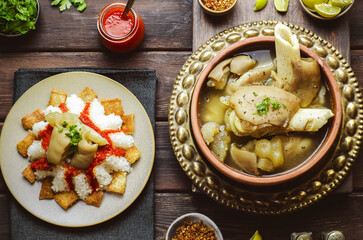 Arabic cuisine; Egyptian oriental Fattah with white rice and crispy bread topped with seasoned garlic red sauce and chunks of cow's trotters. Served with traditional cow's trotters soup.