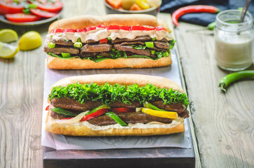 Arabic cuisine; Egyptian traditional sausage and liver sandwiches. Served with tahini sauce, fresh...