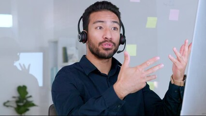 Male call center agent talking on headset and explaining product while working in an office. Confident and cheerful salesman looking at computer and giving advice for customer service and support - Powered by Adobe
