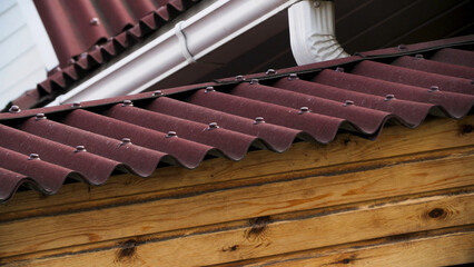 Close up of roof tiles of newly built house, architecture and construction materials concept. Stock footage. Close up of red roof tiles of the cottage.