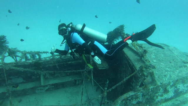 scuba diver at shipwreck