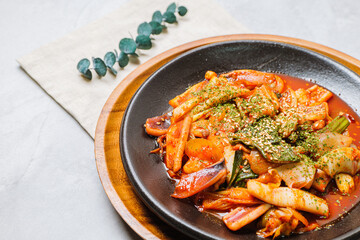 Korean food Stir-fried Squid, ojingeobokkeum : Squid stir-fried with onions, carrots, and cabbage in a spicy mixture of gochujang and red chili powder.