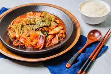 Korean food Stir-fried Squid, ojingeobokkeum : Squid stir-fried with onions, carrots, and cabbage in a spicy mixture of gochujang and red chili powder.