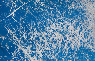 Blue glass with scratching marks grunge background texture