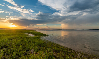 Coastal sunset by the marsh