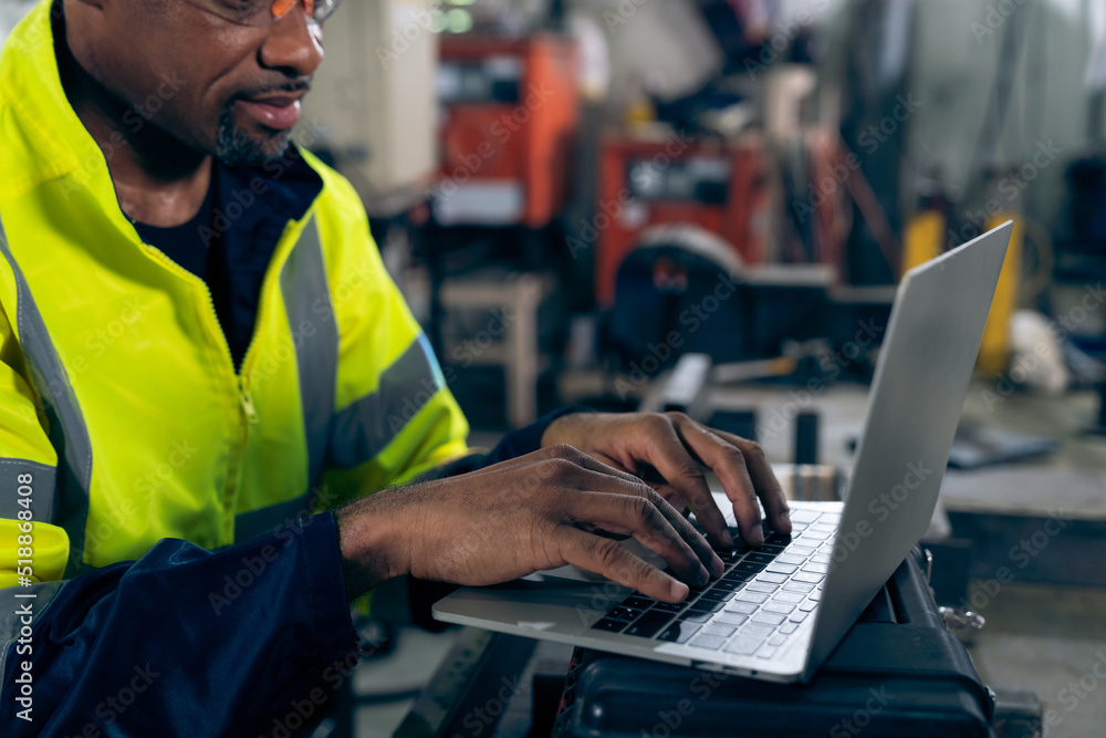 Poster factory worker working with laptop computer to do adept procedure checklist . factory production lin