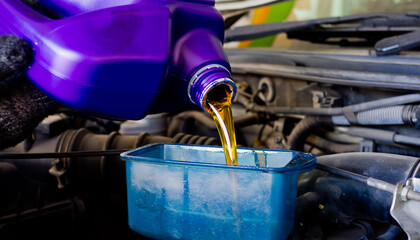 change oil car engine, filling the engine oil
