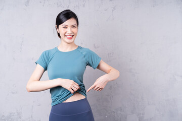 Portrait of young Asian woman wearing gym outfit