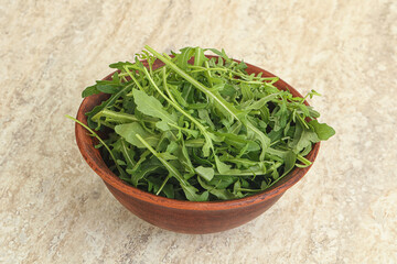 Fresh green arugula in the bowl