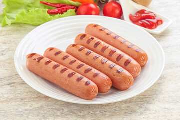 Grilled sausages with tomato sauce