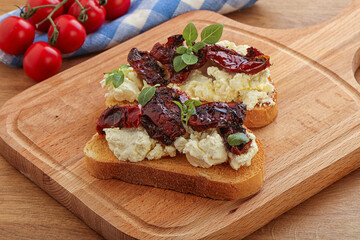 Bruschetta with soft cheese and tomato