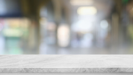 Empty white marble stone table top and blur glass window interior restaurant banner mock up abstract background - can used for display or montage your products.