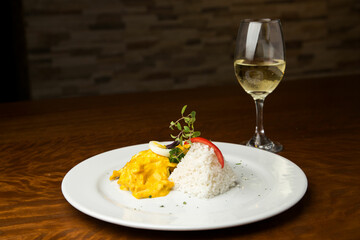 Typical dish of Peru, aji de gallina on a restaurant table.