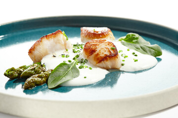 Luxury dish - grilled scallops with asparagus and creamy espuma. Roasted scallop with cream sauce...
