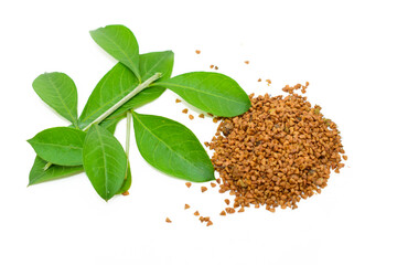 Mehendi or henna leaves and powder heap isolated on white background, Lawsonia inermis powder, Herbs for hair.