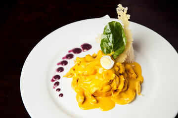 Typical dish of Peru, aji de gallina on a restaurant table.