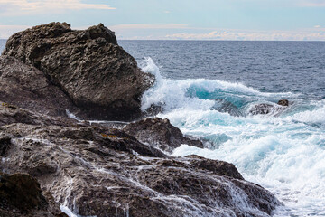 Fototapeta premium Waves on the rocks, Bermagui, NSW, June 2022