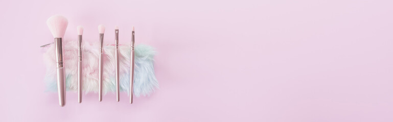 Beauty and Makeup concept from facial cosmetics, blush brush, brow brush, highlighter palette and...