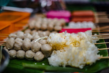 Meatballs and jellyfish skewers ready to be fried for sale at the Chak Ngaew Chinese Community Market, Thailand.