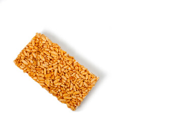 Sweetness from grains of puffed rice, shot close-up on a white background.