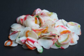 colorful raw crackers on black background