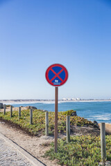 A traffic sign of the forbidden zone on the road near the beach of Portugal
