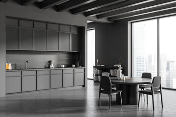 Grey kitchen interior with eating table and chairs, kitchenware and window