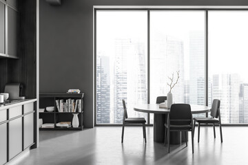 Grey kitchen interior with eating table and chairs, kitchenware and window