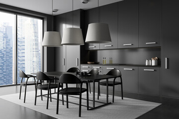 Grey kitchen interior with eating table and chairs, kitchenware and window