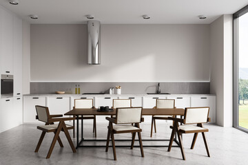 Front view on bright kitchen room interior with dining table
