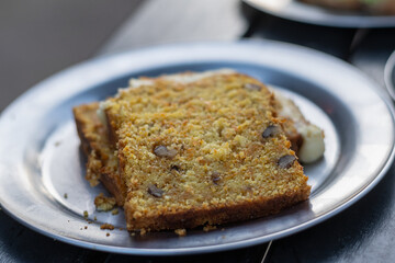 portion of orange carrot and walnut pudding